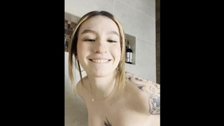 Tattooed hispanic fucking herself at the shower